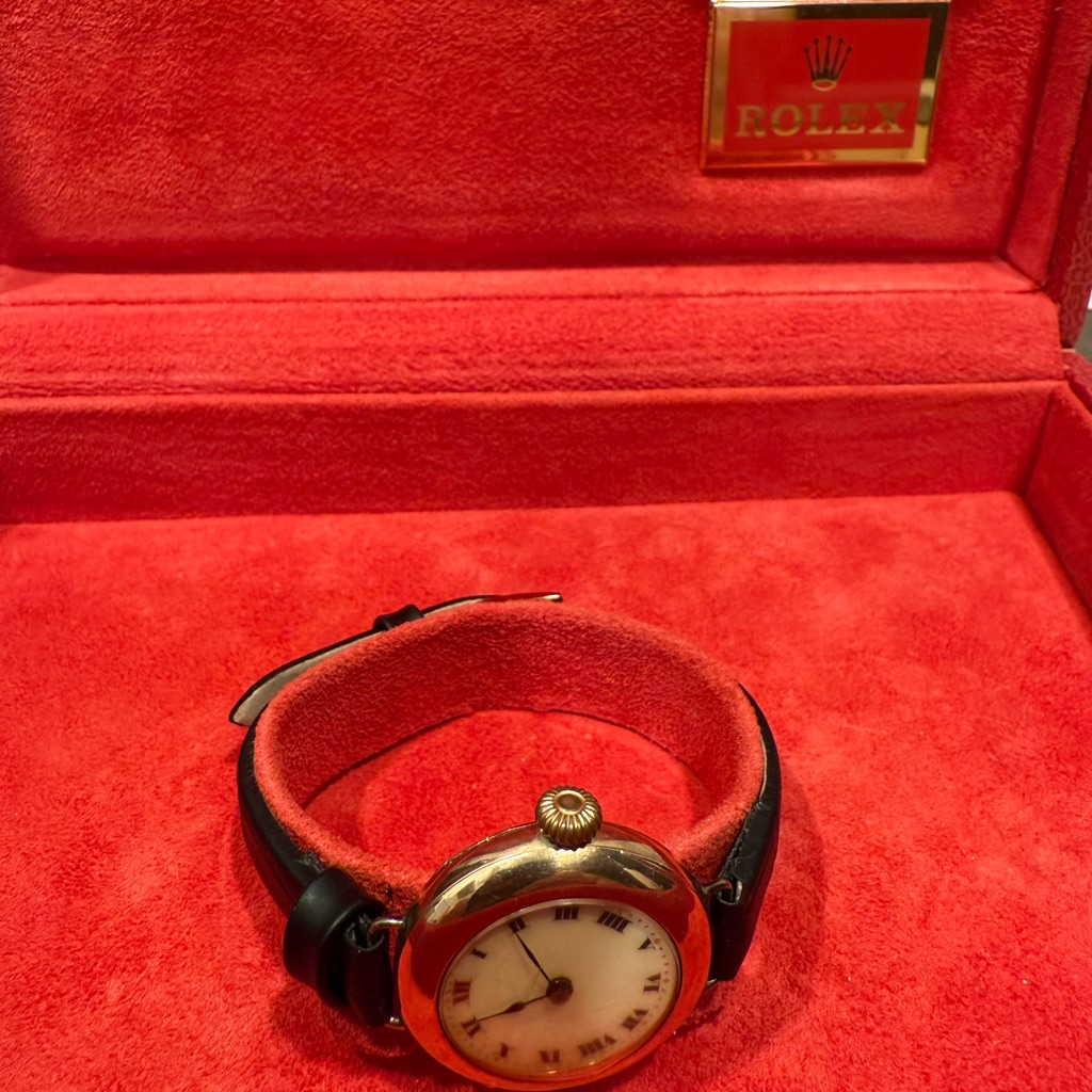 Rolex Watch With Black Strap And Gold Case
